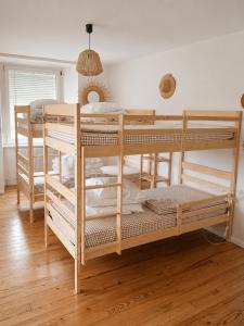 a couple of bunk beds in a room at chambres randonneurs in Plestin-les-Grèves