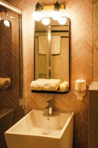 a bathroom with a sink and a mirror at Vila Hora cu Brazi in Zărneşti +72 photos