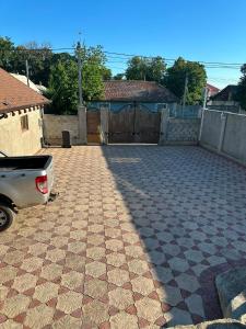 a parking lot with a car parked in a driveway at Vila Lena S in Cahul +2 photos