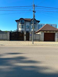 a house on the side of a street at Vila Lena S in Cahul