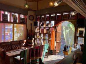 a living room with a couch and a table at The Pax Hostel in Osaka