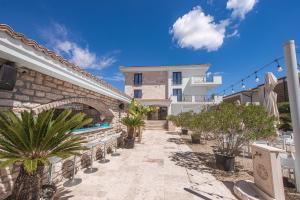 a resort with a swimming pool and a building at Escape Vama Veche in Vama Veche