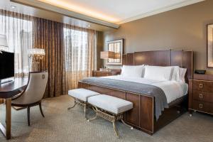 a hotel room with a large bed and a desk at Curtiss Hotel, an Ascend Collection Hotel in Buffalo +72 photos