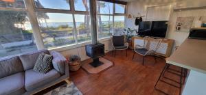 a living room with a couch and a stove at The waterfront retreat in Lock Sport