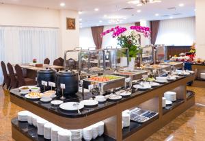 a buffet of food on a table in a room at Sai Gon Da Lat Premium in Da Lat