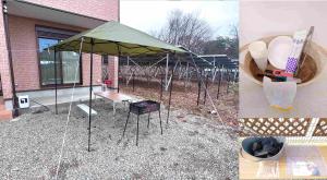 a green tent sitting outside of a building at すずめのとまりぎ in Nasu +1 photo
