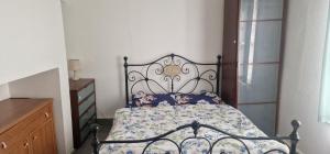 a bedroom with a bed and a dresser at Rear Borough Suite in Ipswich