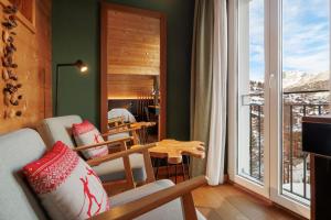 TV a/nebo společenská místnost v ubytování Amber Ski-in/out Hotel & Spa