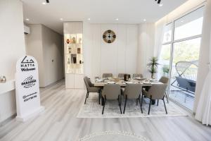 a dining room with a table and chairs at paradise resort and spa in Hatta