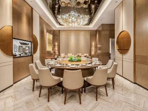 a dining room with a table and chairs at Radisson Hotel, Beijing DaXing Airport in Beijing