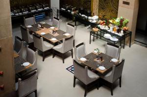 an overhead view of a restaurant with tables and chairs at Buddha Heritage in Patna