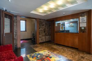 a lobby with a waiting area in a building at Yeongdeungpo Hotel Jago in Seoul