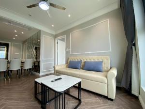 a living room with a couch and a table at Amanda Apartment Quy Nhon in Quy Nhon +76 photos