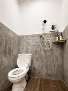 a bathroom with a toilet and a shower at Casa Le Rock in Kuah +27 photos