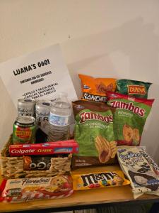 a pile of chips and other snacks on a table at Luana's 0601 in Choluteca