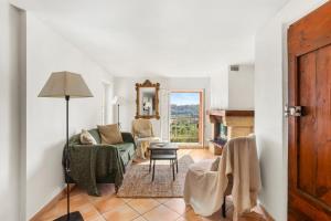 a living room with a couch and a chair at La Villa Andéria in Callian +19 photos