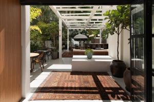 an entrance to a house with a rug on the floor at Theodor Rothschild Tel-Aviv in Tel Aviv