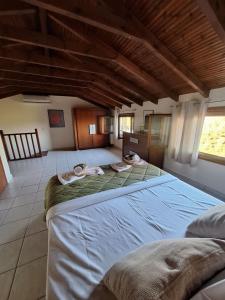a large bedroom with two beds in a room at nikol villa elani in Siviri +26 photos