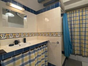 a bathroom with a sink and a mirror at Chez cazalets in Susmiou +33 photos