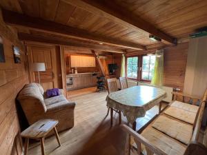 a living room with a couch and a table at Reiter- und Ferienhof Wacker in Schöna