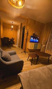 a living room with a couch and a tv at Luxury Cottage Resort in Patara-Tsemi +71 photos