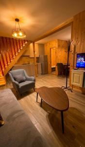 a living room with a table and a couch and a table sidx sidx at Luxury Cottage Resort in Patara-Tsemi