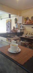 a coffee cup sitting on a counter in a kitchen at Relax Inn in Ban Phe