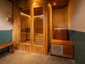 a sauna with wooden walls and a bench in a room at Villa Famara Pererenan, Canggu by Blacksand in Tumbak Bayuh