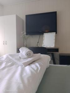 a hotel room with a bed with a towel on it at Apartment in Stryn in Stryn