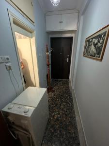 a laundry room with a washer and dryer and a hallway at LADY E. in Kavála +16 photos