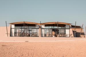 a building in the middle of the desert at The Desert Grace in Solitaire