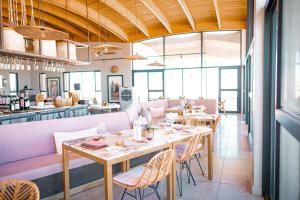 a restaurant with tables and chairs in a room at The Desert Grace in Solitaire +30 photos