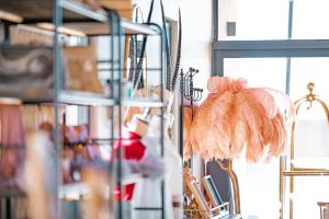 a shop with a bunch of feathers hanging on a rack at The Desert Grace in Solitaire