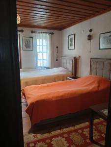 a bedroom with two beds and a window at Uşak Sanat Konağı in Uşak