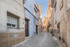 an alley in an old town with buildings at San José Moratalla in Moratalla