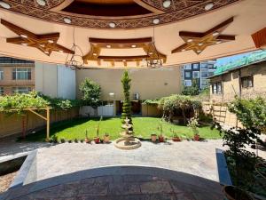a courtyard with a fountain in the middle of a building at Kite Residence - Secure Stay in Kabul