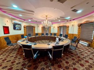 a large meeting room with a large table and chairs at Kite Residence - Secure Stay in Kabul