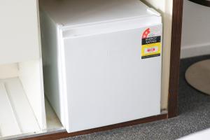 a white refrigerator door with a sticker on it at Beachside Studio with Stunning Ocean View in Gold Coast