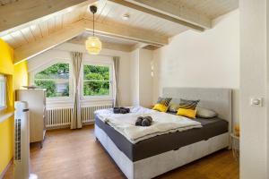 a bedroom with a large bed in a room at Villa Encanto in Albstadt