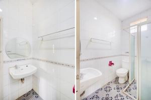 a white bathroom with a sink and a toilet at Urbanview Hotel RDN Oasis Cisarua by RedDoorz in Brujul