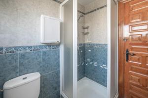 a bathroom with a shower and a toilet and a shower at Casa Paula in Mazarrón +17 photos