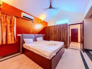 a bedroom with a bed in a room at CK Beach House in Chennai