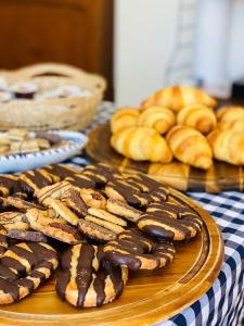 a table topped with plates of cookies and pastries at Stagnone Area Zero in Birgi Vecchi