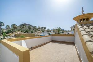 a balcony with a view of the city at Casa Paula in Mazarrón