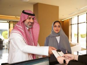 a man and a woman standing in front of a computer at La Terrasse Hotel in Jeddah +67 photos