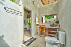 a bathroom with a toilet and a sink at Sayuban Villa in Susut +60 photos
