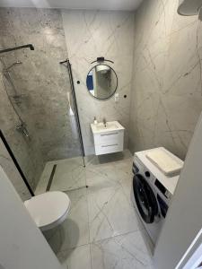 a bathroom with a shower and a toilet and a sink at Olmar Przybrodzin in Przybrodzin +7 photos