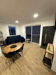 a living room with a couch and a table at Olmar Przybrodzin in Przybrodzin