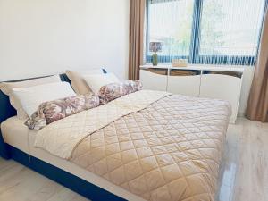 a bed in a room with a large window at Villa Lea in Bihać +50 photos