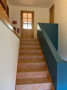 a staircase leading up to a door in a house at Ferienwohnung Vielfalt in Höringhausen